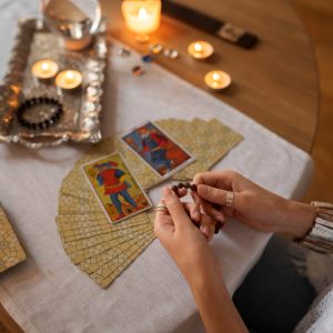 high-angle-woman-reading-tarot (1)